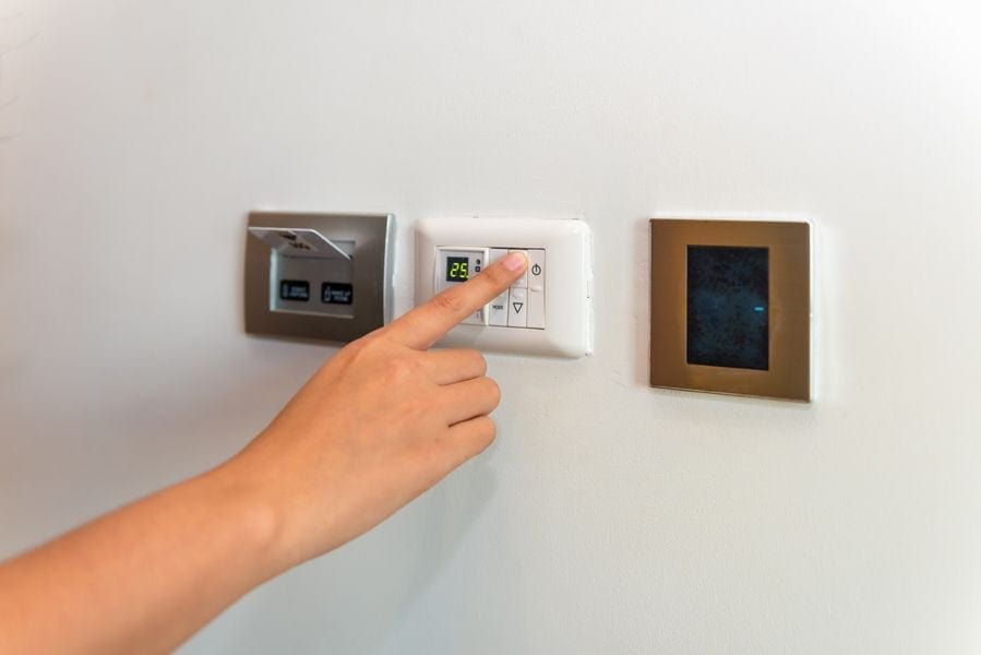 Image of three thermostats connected to different HVAC systems. Heat Pump Versus Furnace.