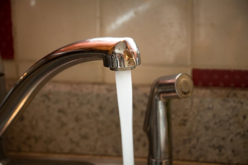 Running water coming out of a faucet.